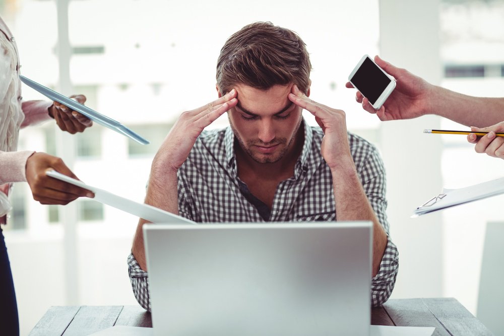 distracted man with no productivity in the workplace