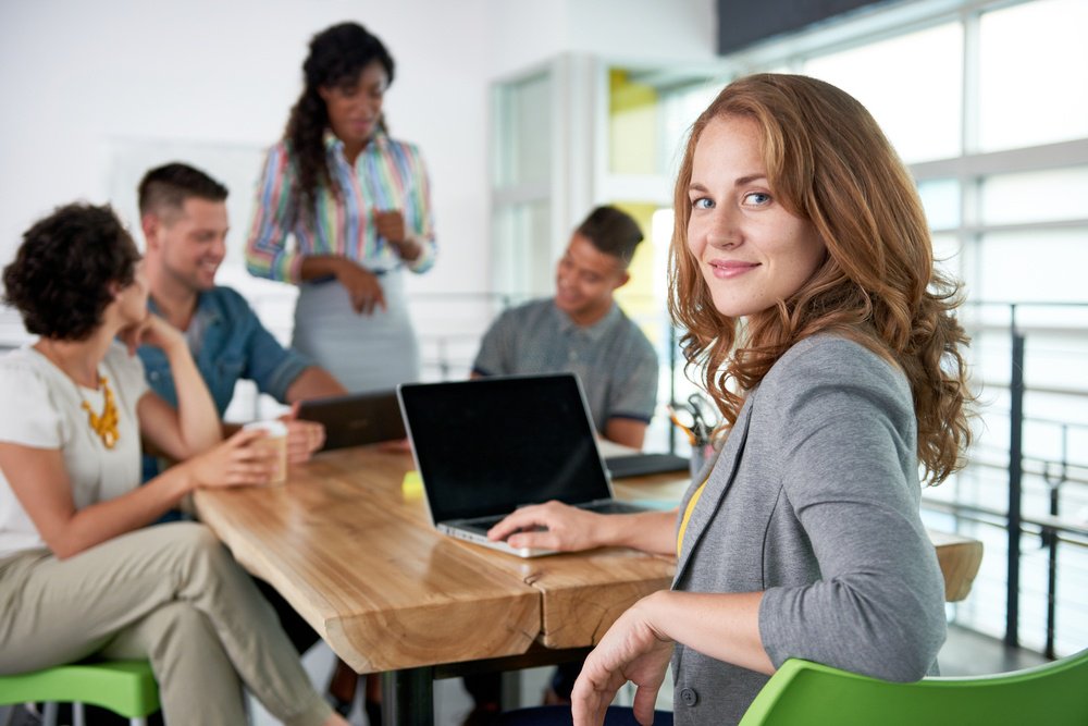 proud woman who is showing productivity in the workplace