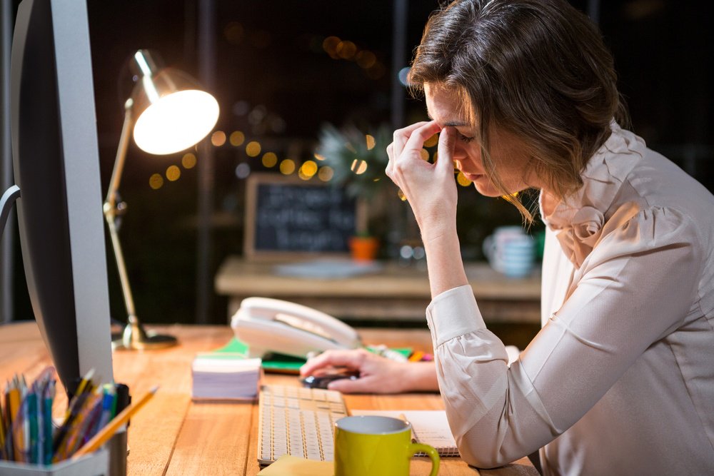 stressed woman with no productivity in the workplace